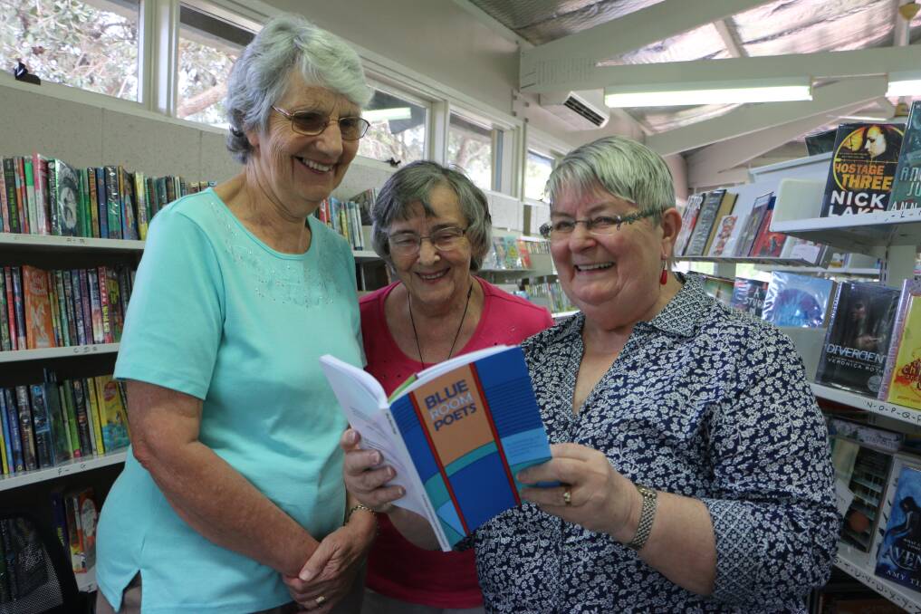 BUSY ROOM: From left, Blue Room Poets Jeanette Campbell, Jill Overton and Chris Langshaw at Wangi Wangi Library. Picture: David Stewart