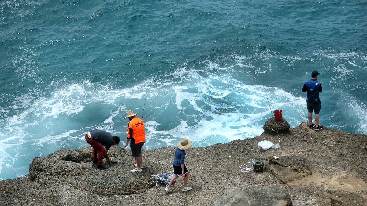 A handful of fishermen back on the rocks on Thursday a day after a woman was swept to her death at Snapper Point. Picture: Marina Neil