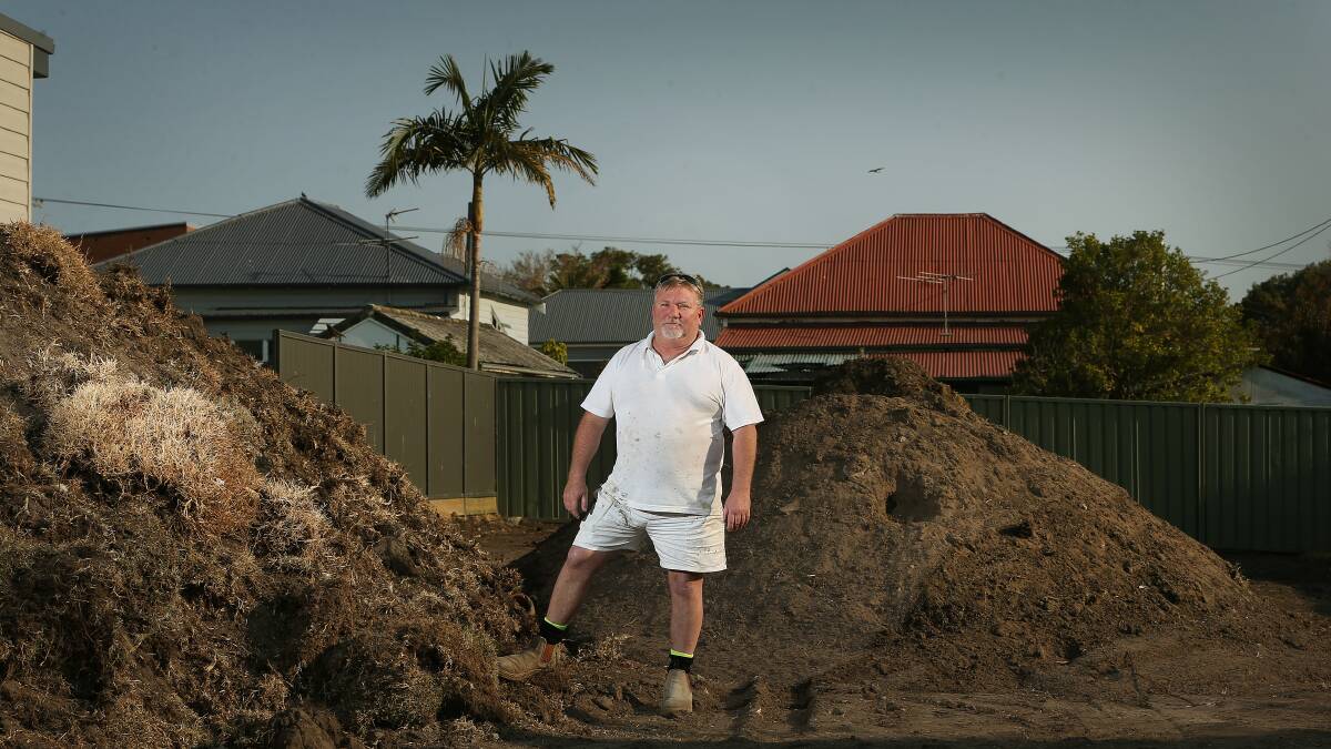 FED UP: Mark Hambier has been waiting for months to dump tonnes of disturbed lead-laden dirt and grass from the yard of his Fifth Street, Boolaroo, property. Picture: Marina Neil