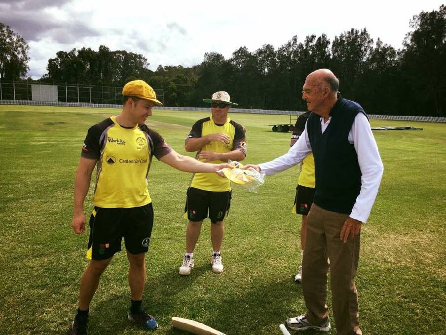 MOMENT: Luke Garaty gets his first grade debut cap from grandfather Jack.