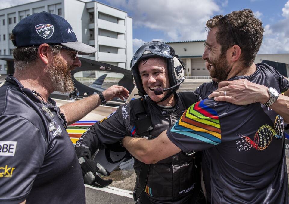 SMILES ALL ROUND: Matt Hall celebrates with his crew after winning the Red Bull Air Race world championship in Japan on Sunday.