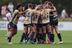 The Newcastle Jets get around rookie goalkeeper Lily-Rose Dunbar after the 17-year-old made her A-League debut at No.2 Sportsground on Saturday. Picture Getty