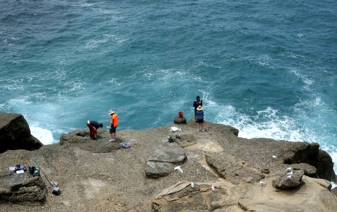 DANGER: Fishermen on the rock ledge at Snapper Point in January, 2018. Ten people have drowned at the Fraser Park site in the past decade. Picture: Marina Neil