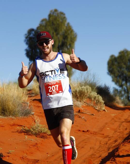 DEVOTED: Mitch Morley running at the Australian Outback Marathon in Uluru.