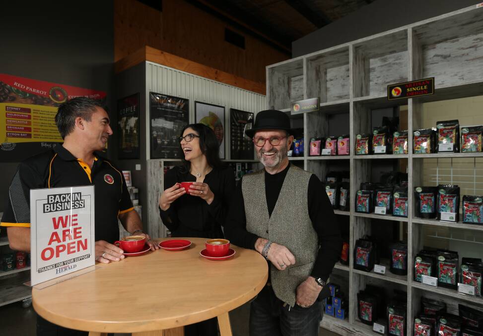 OPEN FOR BUSINESS: Red Parrot cafe owner Mike Roycroft, right, with roaster specialists Katie Wells and Rosco Buchanan. Photo: Simone De Peak