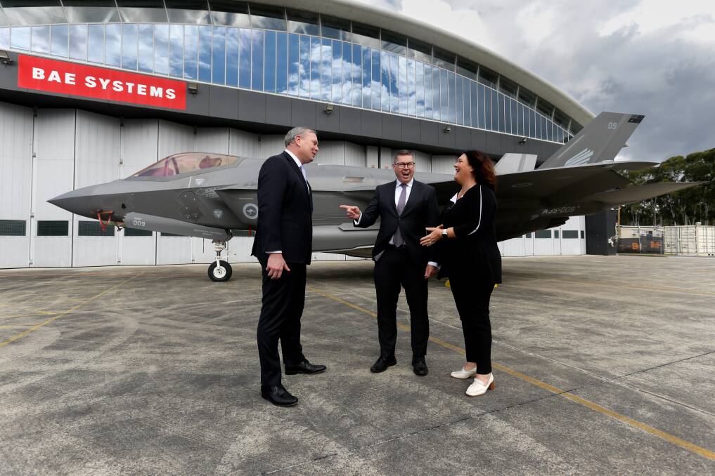 Defence Industry Minister Pat Conroy (centre) described the strategy as a boon for the Hunter's manufacturing outfits, including BAE Systems whose CEO Ben Hudson was pictured here with MP Meryl Swanson at the BAE facility near Newcastle Airport.