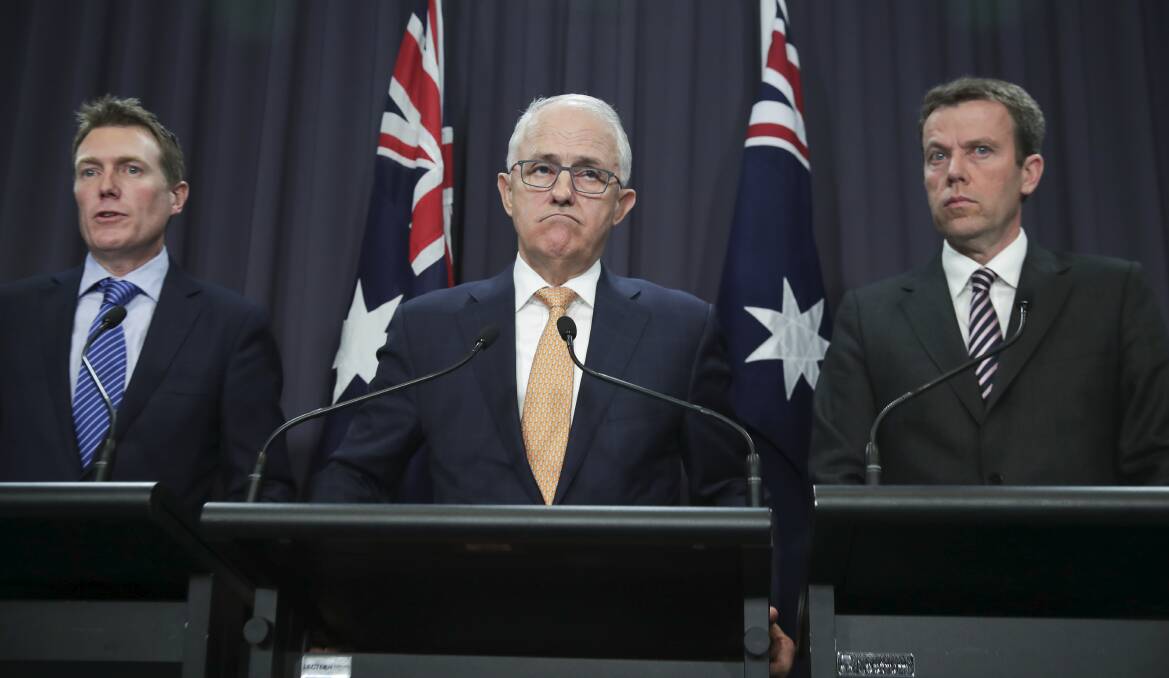 Reforms: Prime Minister Malcolm Turnbull flanked by Attorney-General Christian Porter (left) and Social Services Minister Dan Tehan announce sweeping child sexual abuse reforms.  