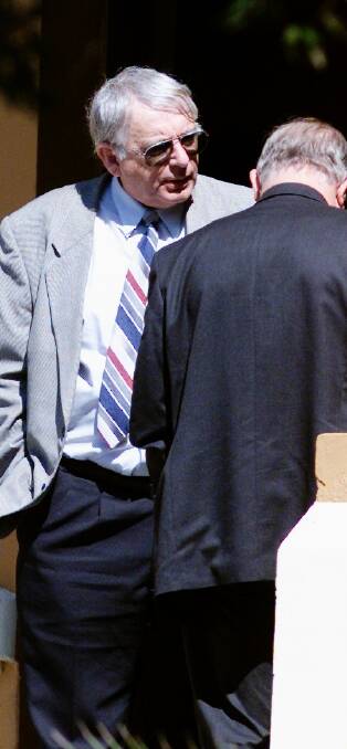 Charged: Anglican priest George Parker outside Newcastle Courthouse in 2001 during his trial for child sex offences against Steve Smith.