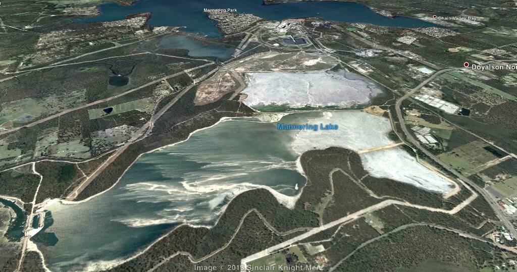 Asbestos: An aerial view of the Vales Point power station site showing its central position between Mannering Lake and Lake Macquarie. The power station's large ash dam is between the two water catchments. 