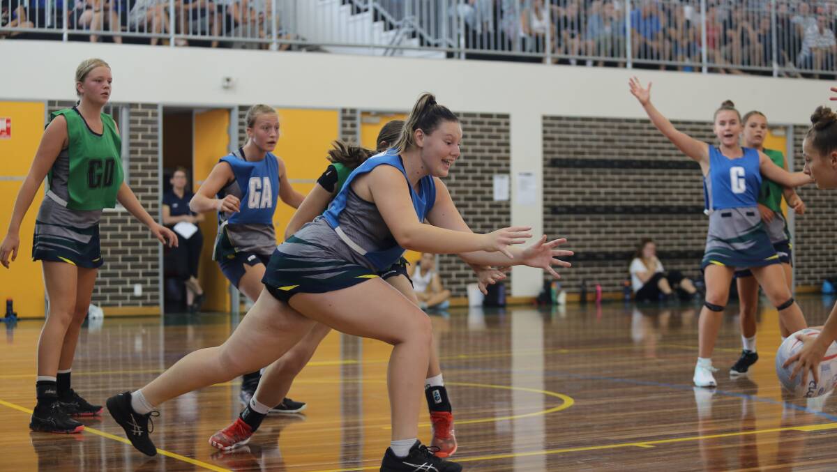 Bolton Point's Crystal Eade, 15, in action during Saturday's Hunter Academy of Sport netball games. 