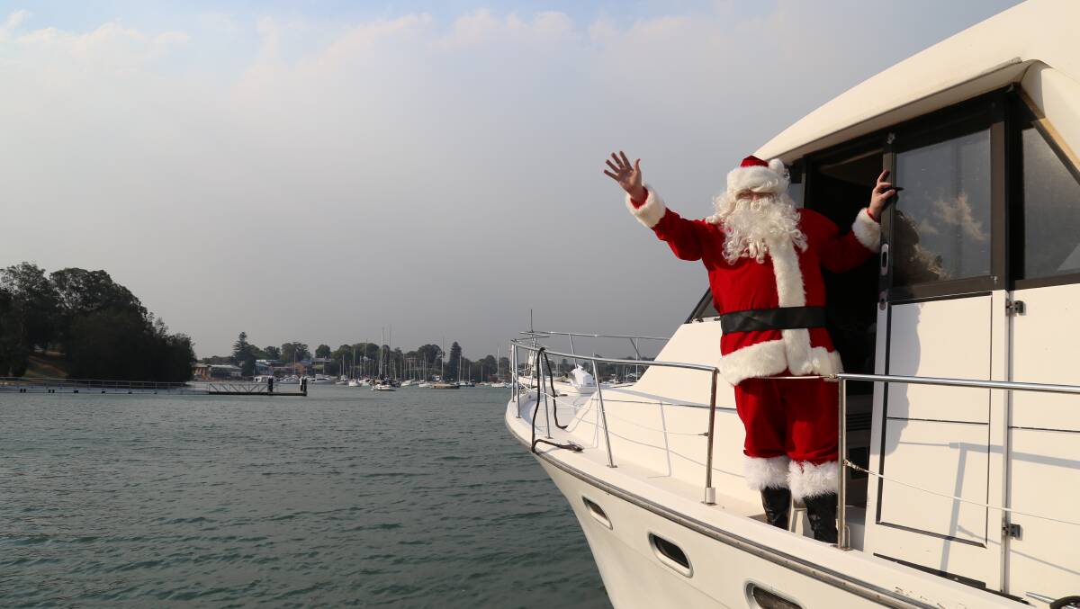 HO HO HO: Santa will once again be visiting the western shores of Lake Macquarie on Christmas Eve. Pictures: Ellie-Marie Watts