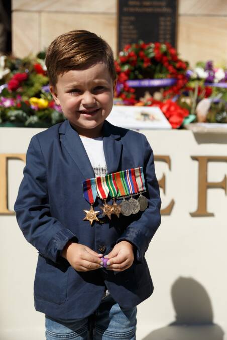 SERVICE HONOURED: Cameron Lenworthy of Fishing Point wearing his great grandfather's medals at the 2019 Anzac Day mid-morning commemorations in Wangi Wangi. Picture: Max Mason-Hubers