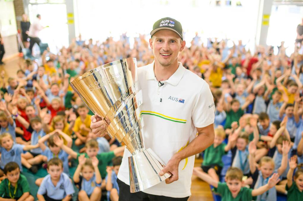 Kyle Langford with the SailGP championship trophy at Coal Point Public School in November. 