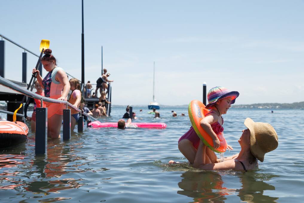 Aleksandra Yates of Belmont and her daughter Eva, 3, cool off at Belmont Baths. Picture: Max Mason-Hubers 