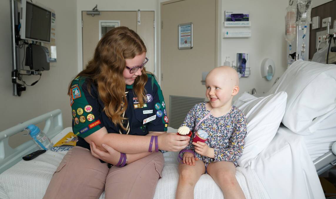 ICING ON TOP: Cancer survivor and NSW Scout of the Year Jacinta Gomez in John Hunter Children's Hospital with patient Ena Burgess, 4. Jacinta is fundraising for the hospital. Picture: Max Mason-Hubers 