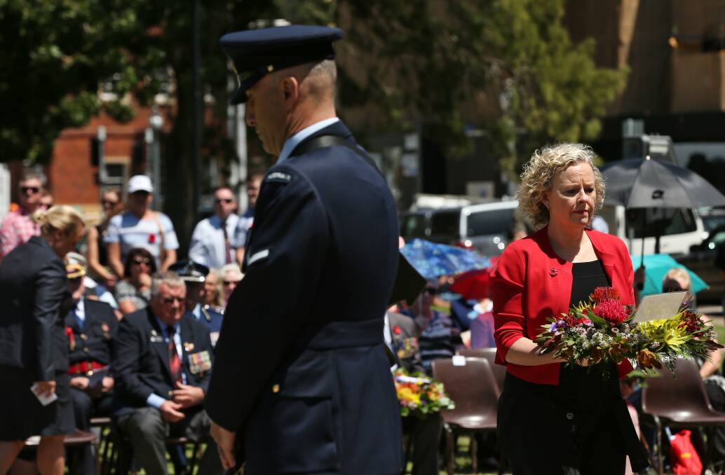 HONOUR: Sharon Claydon lays a wreath at a Remembrance Day service in 2016.  