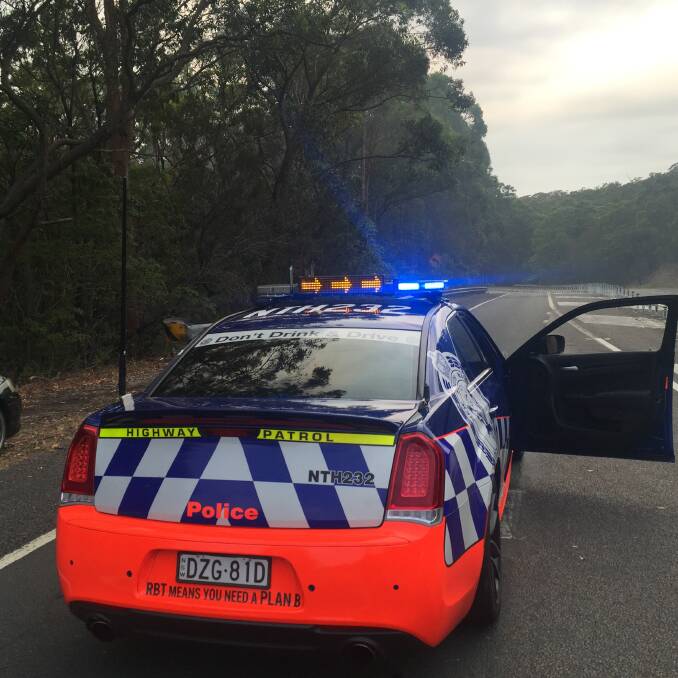 A police roadblock on Wangi Road at Summerhill Drive. Picture: Scott Bevan