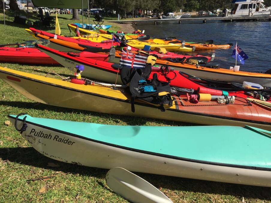 REST AT WANGI: The kayaks lined up along the lake shore, which is filling with Australia Day revellers. 