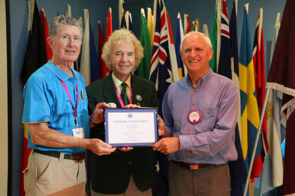 PRAISED: Lions district governor David Heggart, centre, presents a certificate of appreciation to Wangi Lions Club's convention chairman Tony Prior, left, and president John Farrington. Picture: David Stewart