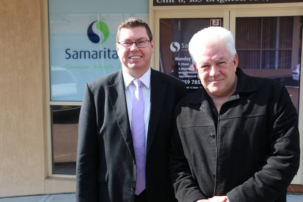 HELP FOR HELPERS: Pat Conroy, left, with John Barham at the Toronto Samaritans shop on Monday. Picture: Jamieson Murphy