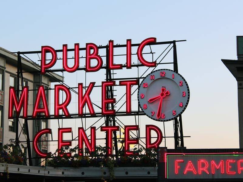 Tourists at Seattle's Pike Place Market were treated to two music superstars busking on Saturday.