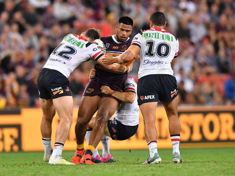 Payne Haas (centre) ran 206m and scored an impressive try for Broncos against the Roosters.