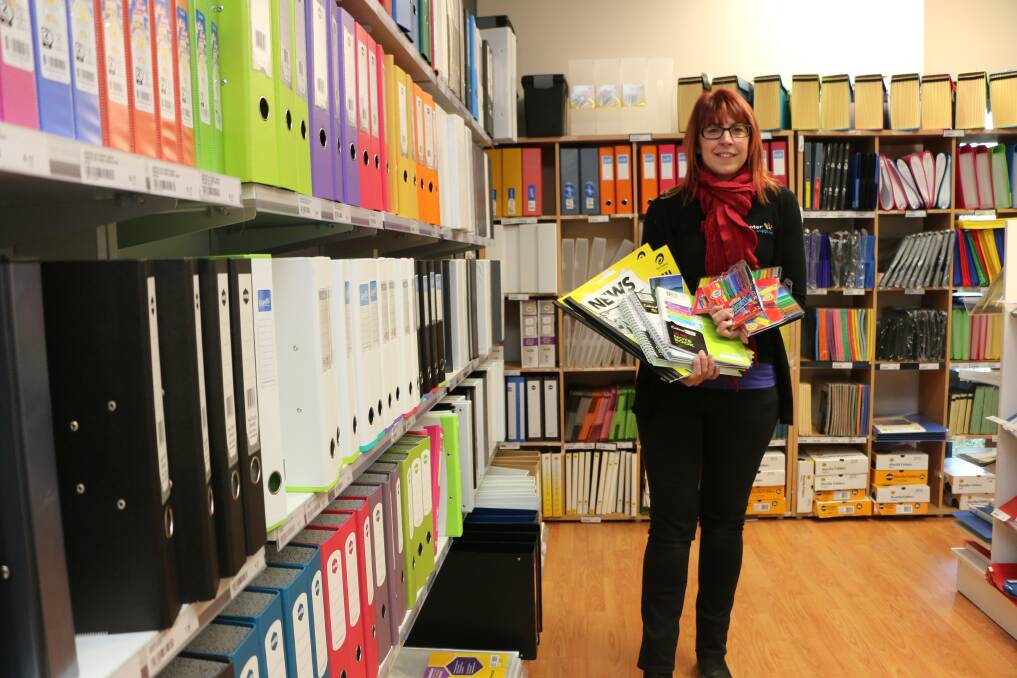 SCHOOL'S IN: Sharen Griffin of Hunter Office Supplies and a sample of the stationery items to be unpacked in Vanuatu this week. Picture: David Stewart