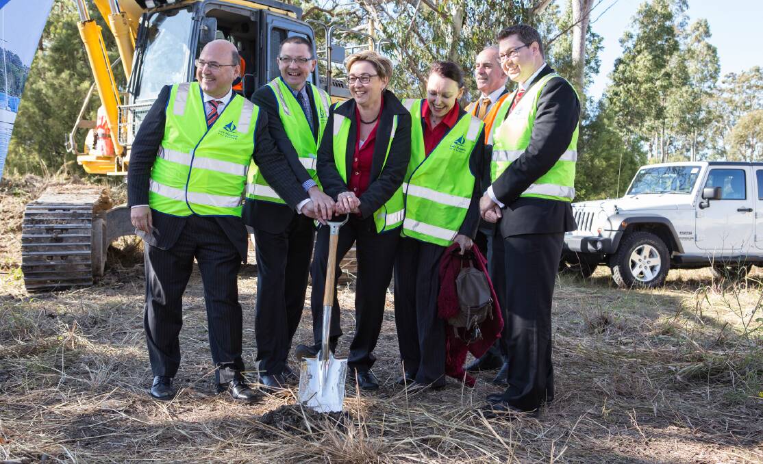 MANY HANDS: Pictured at the sod turning are, from left, Senator Arthur Sinodinos; Parliamentary Secretary for the Hunter, Scot MacDonald; Lake Macquarie City mayor, Jodie Harrison; Member for Wallsend, Sonia Hornery; Member for Lake Macquarie, Greg Piper; and Member for Charlton, Pat Conroy.