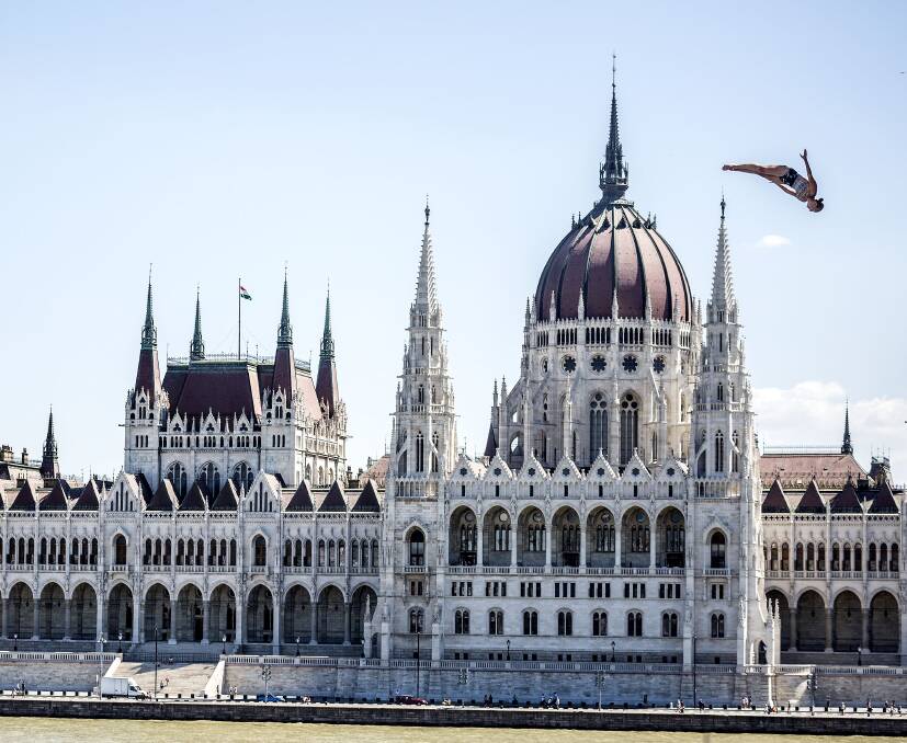 BREATHTAKING: Lake Macquarie's Rhiannan Iffland descends towards the water in the FINA high-diving world champiosnhips in Budapest, Hungary. Picture: AP