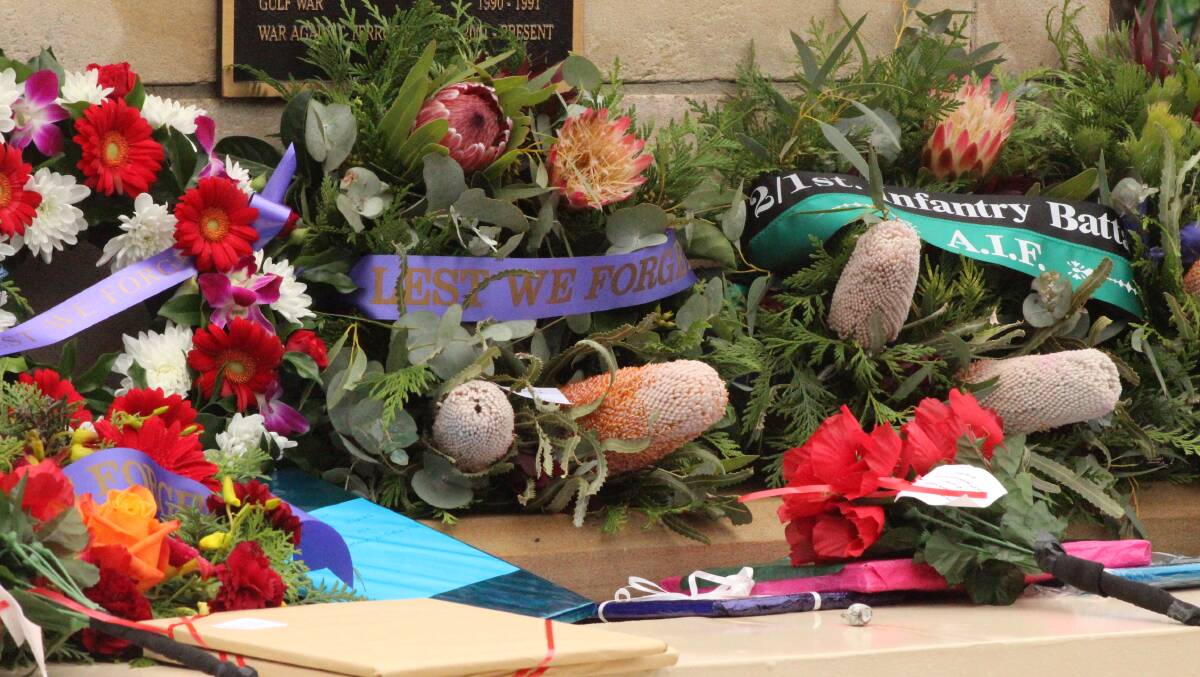 Lest We Forget: Wreaths and flowers laid out at the Wangi Wangi RSL service on Anzac Day.