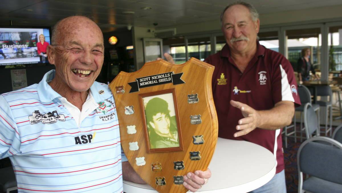 SAFE AGAIN: Dor Creek Swampies president Ron "Corky" Harmer can keep the Scott Nicholls Memorial Shield in his keeping for another year, while Morisset Bulls president Kevin Brown will have to wait. Picture: David Stewart